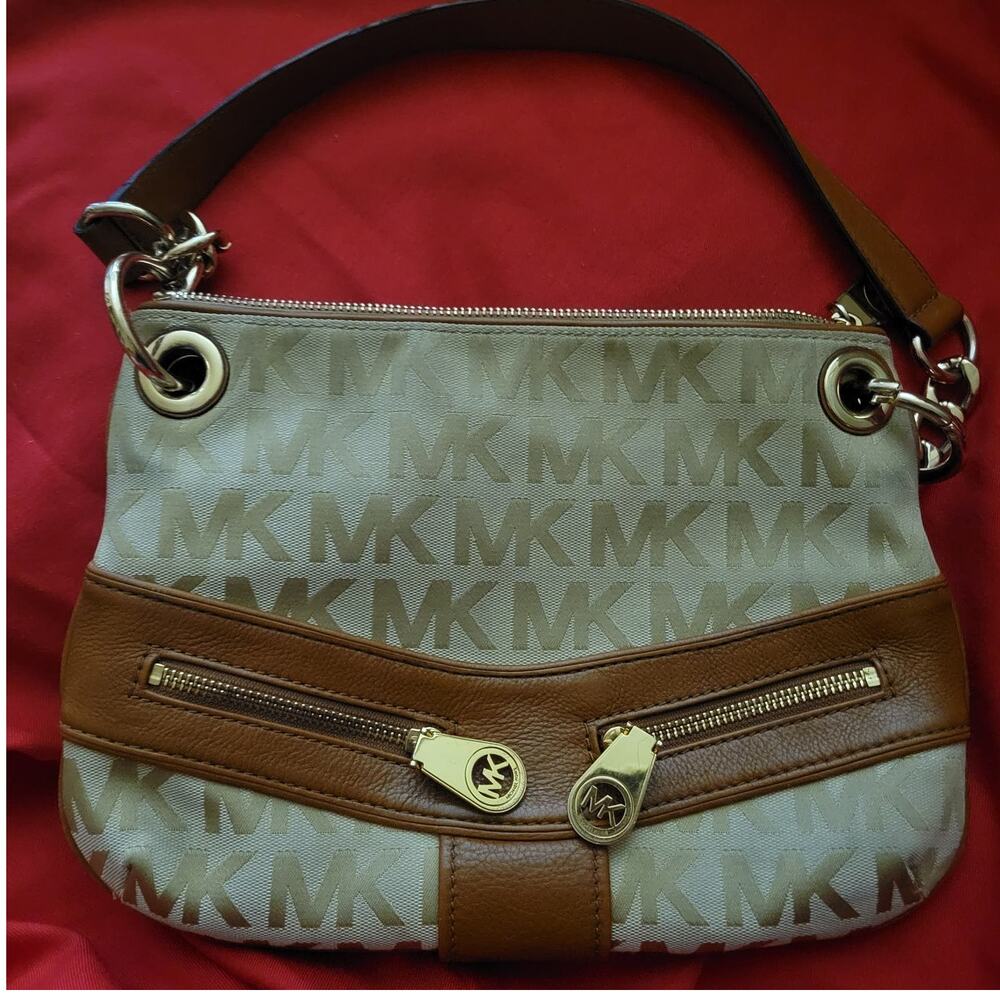 Michael Kors Jamesport Signature Handbag Tab with Leather and Gold Trim Striking